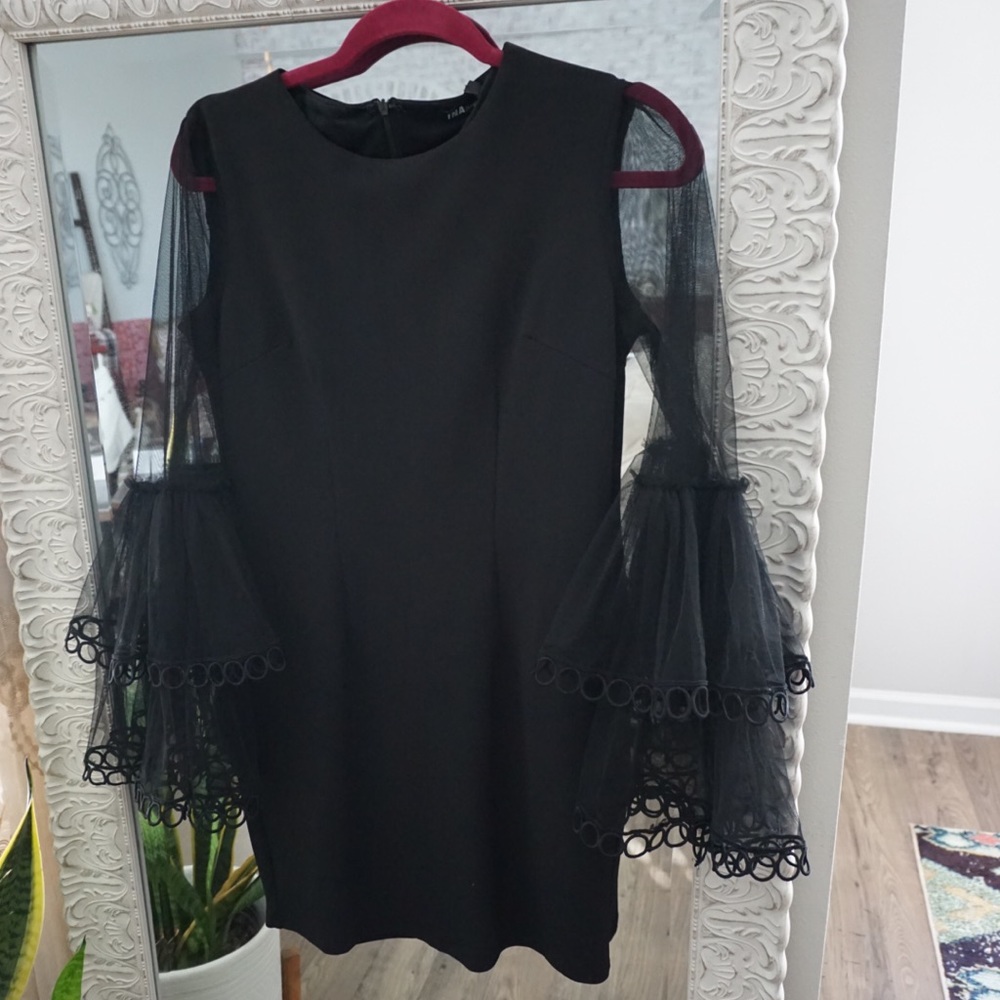 Black fitted dress with sheer bell sleeves